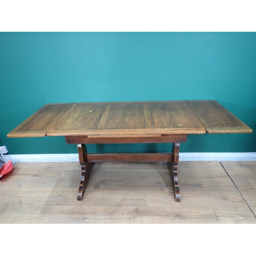 694 - An oak drawleaf Dining Table and two Dining Chairs