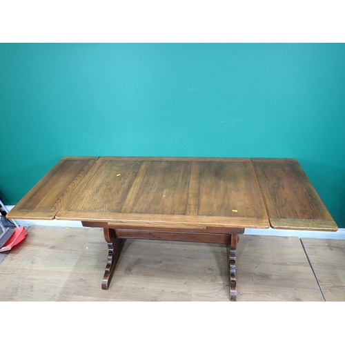 694 - An oak drawleaf Dining Table and two Dining Chairs