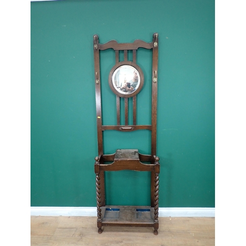 800 - An oak Hall Stand with circular mirror back 6ft 5in H x 2ft W