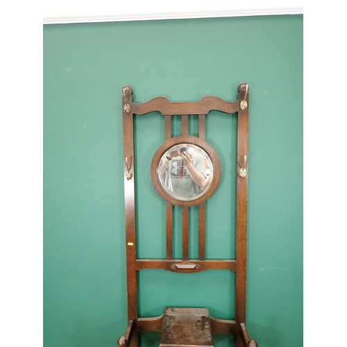 800 - An oak Hall Stand with circular mirror back 6ft 5in H x 2ft W