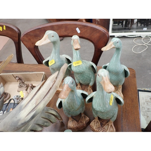 693 - ******WITHDRAWN******

A quantity of pottery models of Ducks and a bone figure of a bird