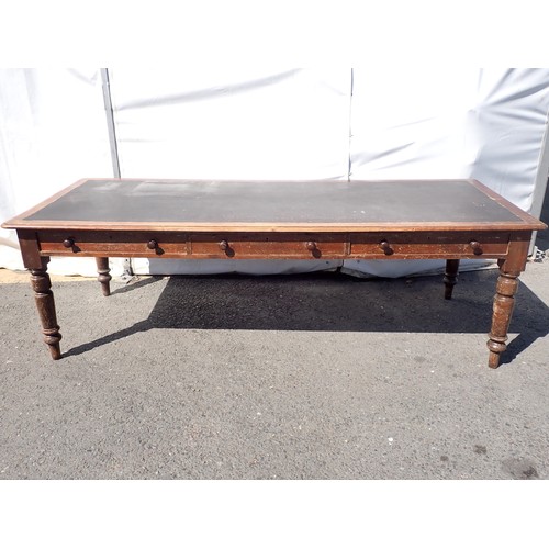 748 - A large Victorian stained pine Table with leather inset top fitted three drawers to each side, on tu... 