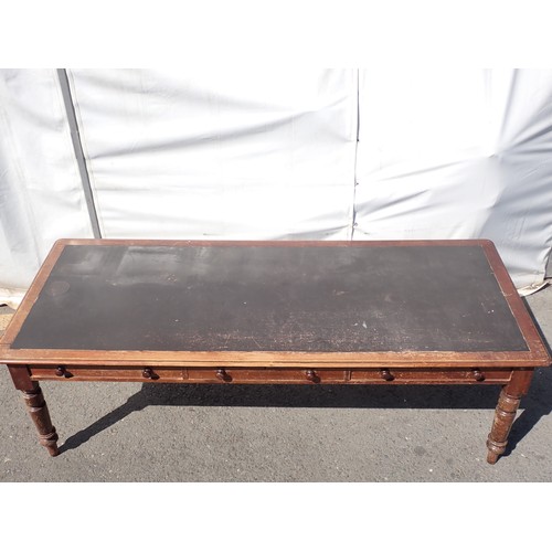 748 - A large Victorian stained pine Table with leather inset top fitted three drawers to each side, on tu... 