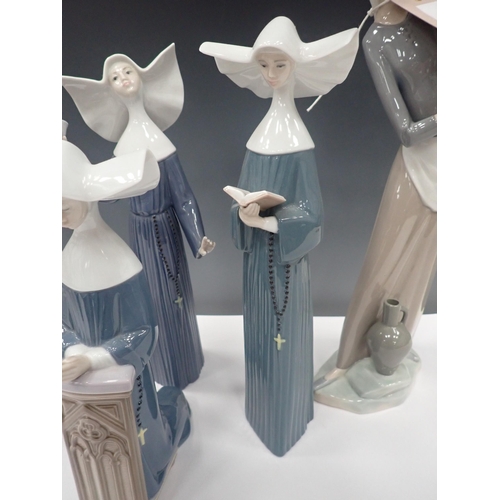 830 - Four Lladro Figurines of Nuns and two other female Figures