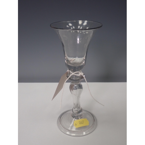 832 - An early 18th Century Wine Glass, c.1730, with a bell bowl, annulated knop and inverted baluster ste... 