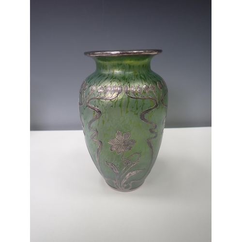 833 - A green iridescent glass Vase with silver overlaid floral design