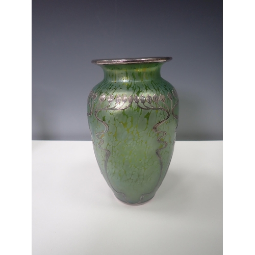 833 - A green iridescent glass Vase with silver overlaid floral design