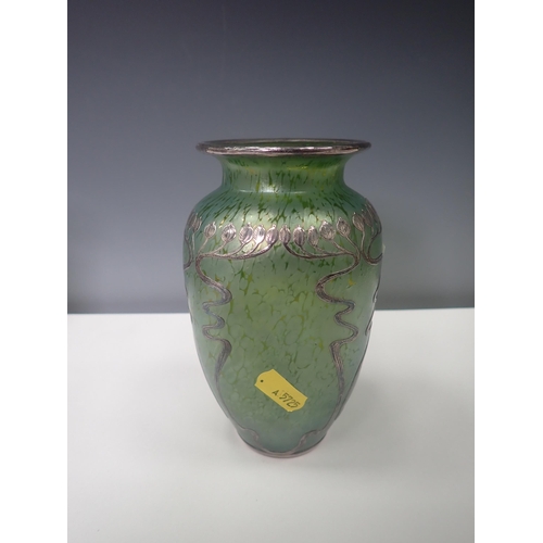 833 - A green iridescent glass Vase with silver overlaid floral design