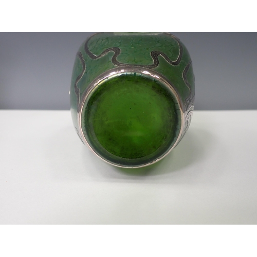 833 - A green iridescent glass Vase with silver overlaid floral design