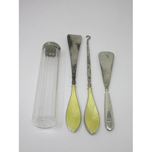 837 - A silver and yellow enamel Button Hook and Shoe Horn, Birmingham 1924, another, and a white metal li... 