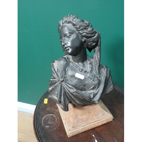 713 - A cast iron Stand, a spelter Bust of a Woman and a Wine Table