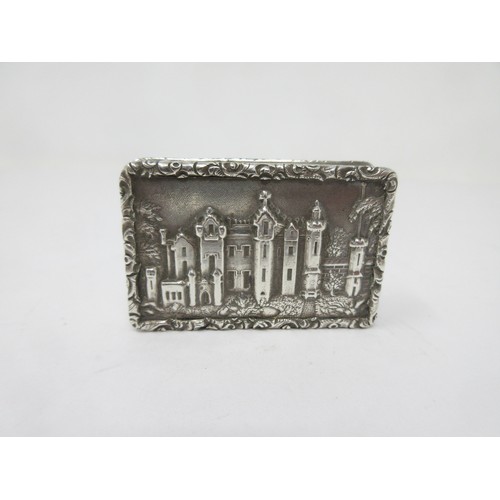 125 - An early Victorian silver castle top Vinaigrette, the lid depicting Abbotsford House, scroll pierced... 