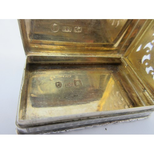 125 - An early Victorian silver castle top Vinaigrette, the lid depicting Abbotsford House, scroll pierced... 