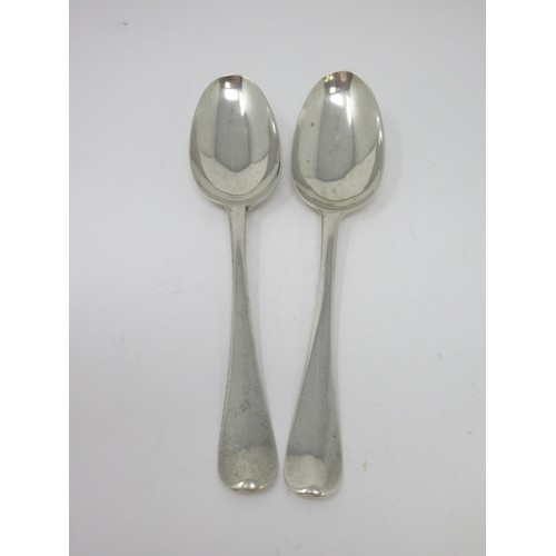 126 - A pair of Georgian silver bottom-marked Table Spoons, Hanoverian pattern, engraved crests