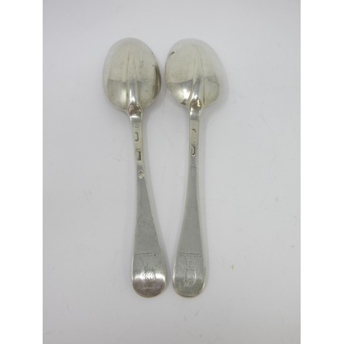 126 - A pair of Georgian silver bottom-marked Table Spoons, Hanoverian pattern, engraved crests