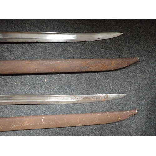 1457 - Two French brass handled Bayonets in metal scabbards