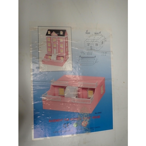 741 - A modern plastic Doll's House with furniture, two boxed wooden Doll's Houses and a small pink painte... 