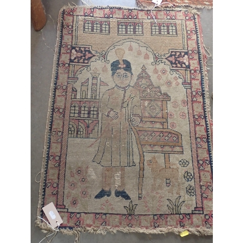 824 - A Persian woollen red ground Rug with blue medallions and two small Mats