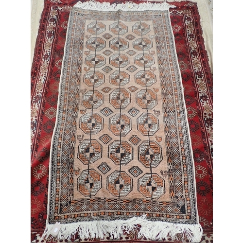 826 - A Persian woollen red ground Rug with three rows of medallions within multiple borders 6ft 6in L x 5... 