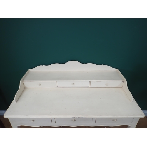 288 - A white painted Dressing Table fitted three frieze drawers on slender cabriole supports, 3ft 11in W