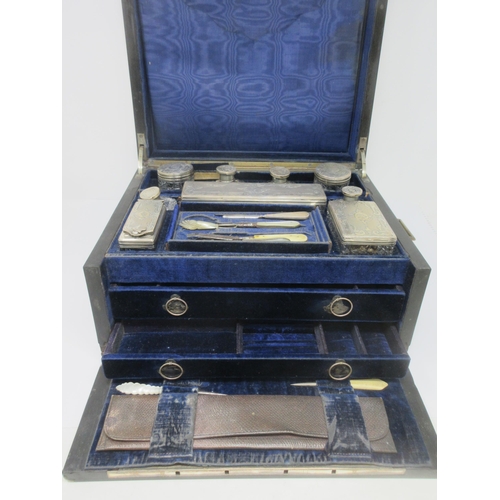 100 - A Victorian burr oak Travelling Dressing Case, the hinged lid with inset shield cartouche enclosing ... 