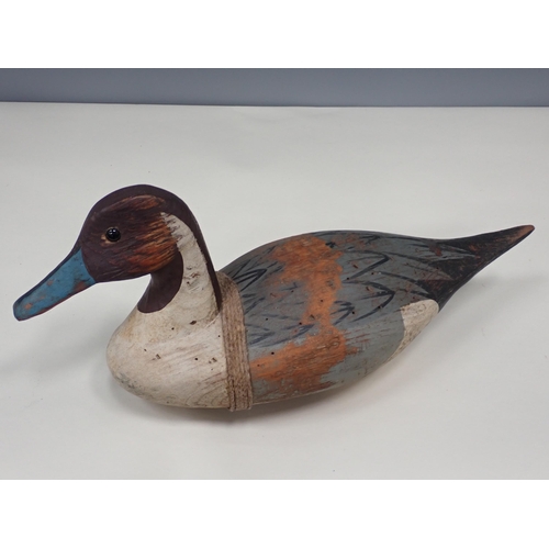 12 - A vintage carved and painted Woodpigeon Decoy, a carved and painted drake Pintail Decoy with tetheri... 