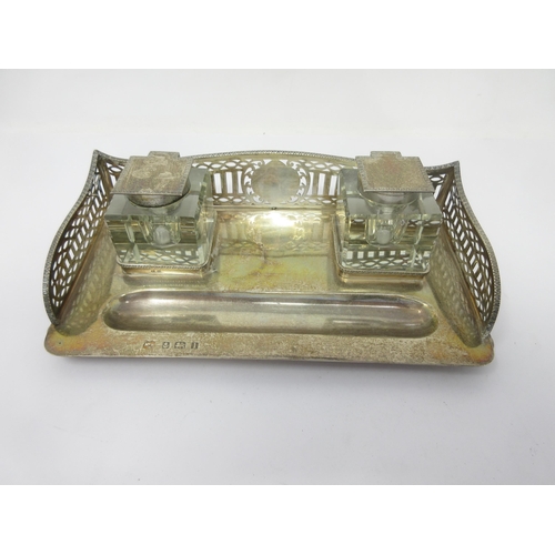 120 - A George V silver Inkstand with pierced gallery on bun feet, Birmingham 1910, fitted pair of plated ... 