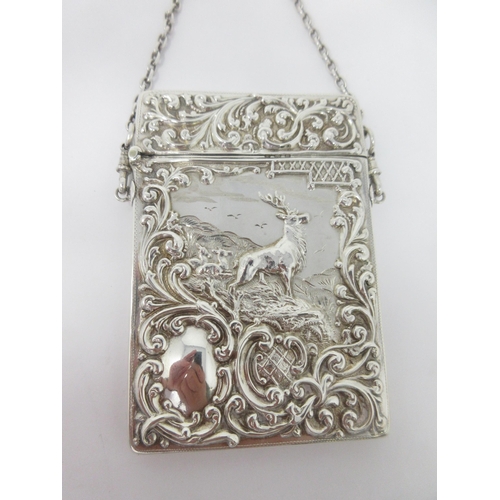 140 - An Edward VII silver Card Case embossed stag and deer in highland landscape, the reverse with scroll... 