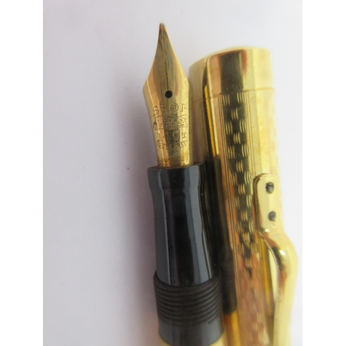 147 - A Spot Fountain Pen with 14ct nib and gold plated case, and a Propelling Pencil with rolled gold cas... 