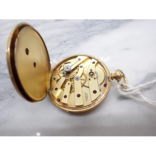 153 - An 18ct gold cased open faced key wind Pocket Watch the floral engraved dial with roman numerals, pl... 