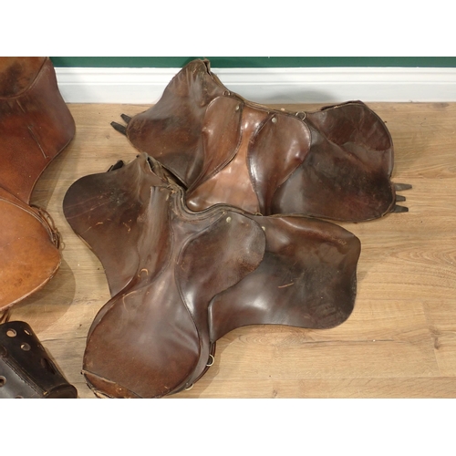 266 - Three old leather Saddles and a Nose Bag