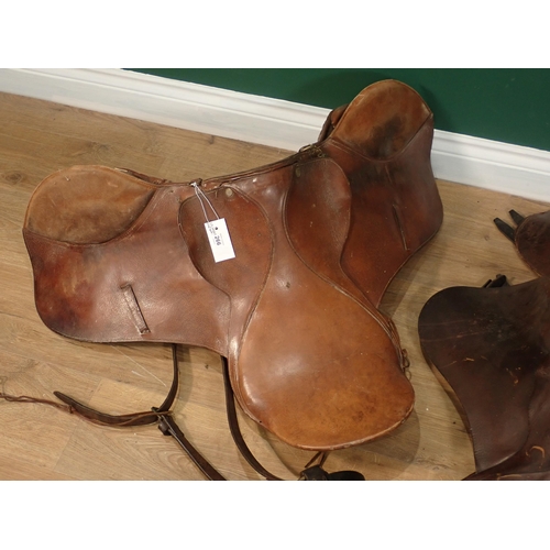 266 - Three old leather Saddles and a Nose Bag