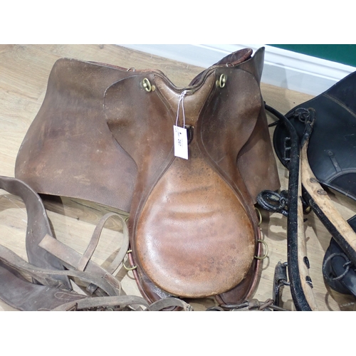 267 - Two old leather Saddles, a pair of Hames and a quantity of Tack