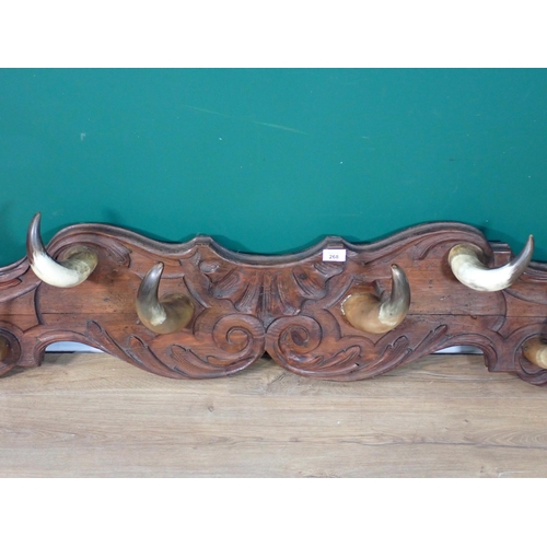 268 - A country house Coat Rack with carved back board and horn hooks 6ft 6in W