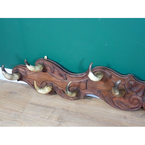 268 - A country house Coat Rack with carved back board and horn hooks 6ft 6in W