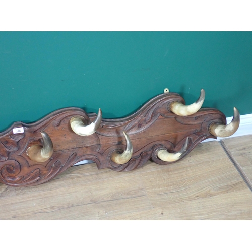 268 - A country house Coat Rack with carved back board and horn hooks 6ft 6in W