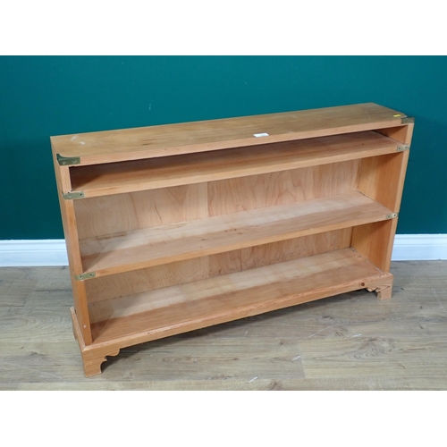 300 - A pine brass bound open Bookcase mounted on scrolled bracket feet 3ft 6in W x 2ft 2in H