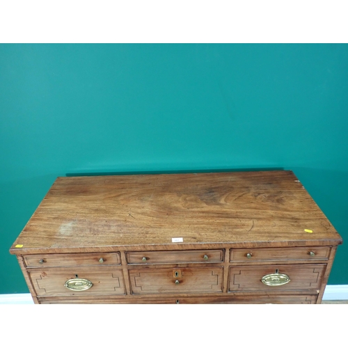 317 - A 19th Century mahogany and ebony strung Chest of six short and three long drawers on shaped bracket... 