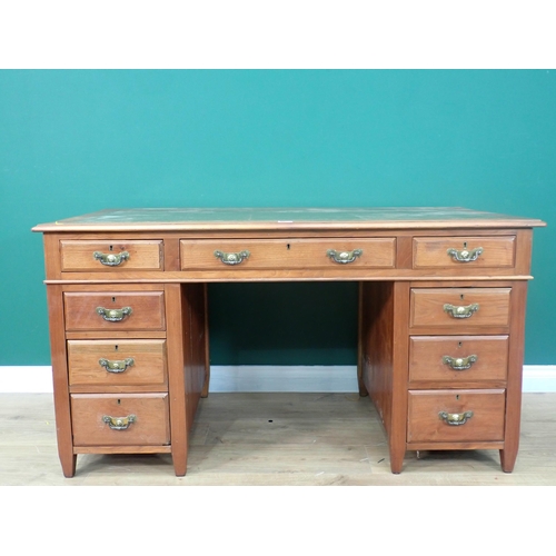 319 - An Edwardian walnut pedestal Desk with green inset writing surface 4ft 7in W x 2ft 5in H