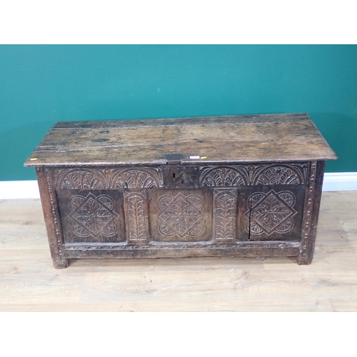 324 - A 17th Century and later oak Coffer with moulded plank lid above three floret carved panels with lat... 