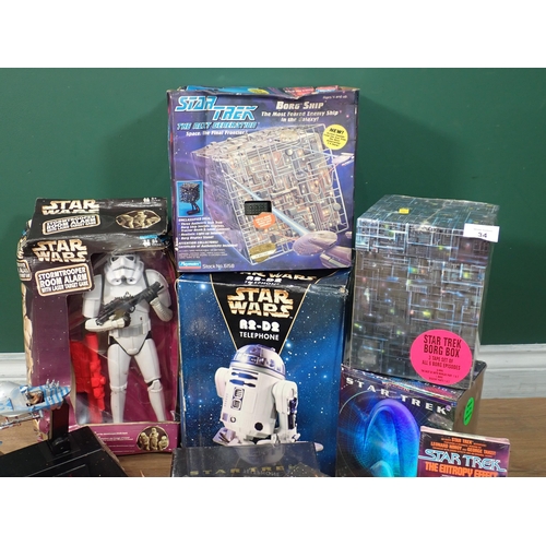 34 - Two boxes of Star Wars and Star Trek Models and collector's items including Storm Trooper Room Alarm... 