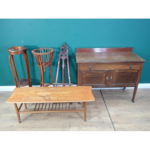 341 - A mahogany two door Cupboard fitted two drawers, a teak Coffee Table, two Plant Stands A/F and an Ea... 