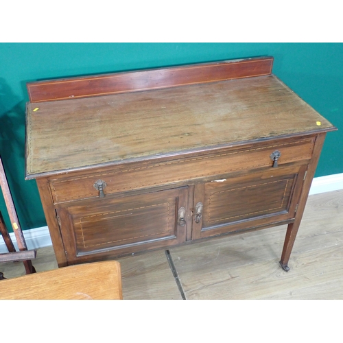 341 - A mahogany two door Cupboard fitted two drawers, a teak Coffee Table, two Plant Stands A/F and an Ea... 