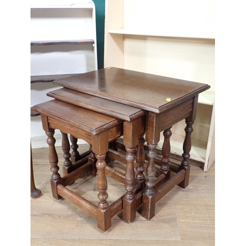 346 - A carved oak Armchair, a nest of three Tables, a demi-lune Table, a cream painted Bookcase and a set... 