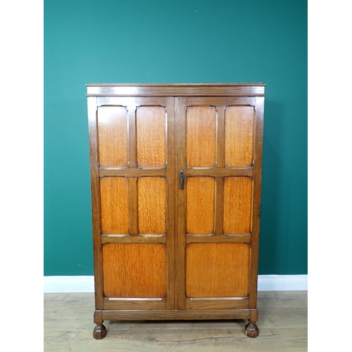 376 - A Waring and Gillow panelled oak two door Cupboard 4ft 4in H x 2ft 9in W