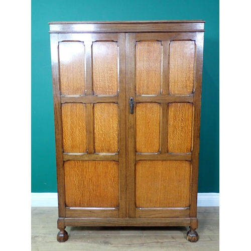 376 - A Waring and Gillow panelled oak two door Cupboard 4ft 4in H x 2ft 9in W