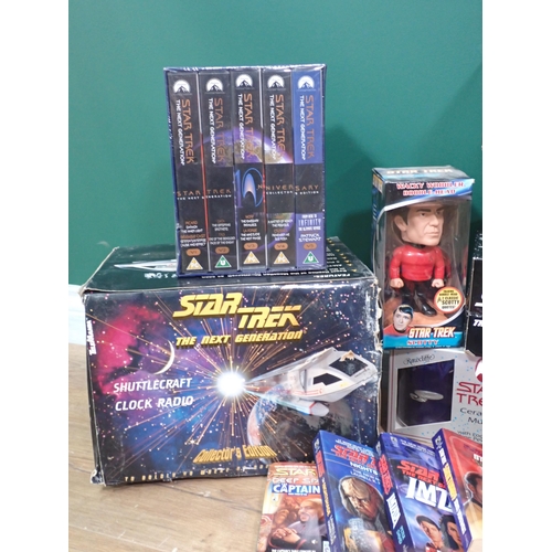 40 - A box of Star Trek Collectables including Clock Radio, Mugs and a box of Star Trek Books