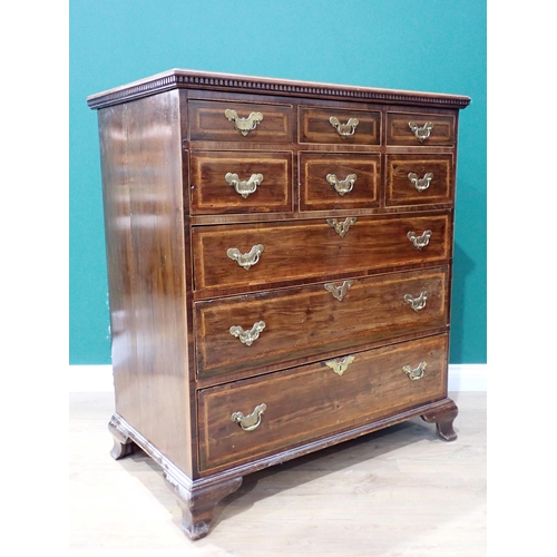 472 - An antique walnut and feather crossbanded Chest of six short and three graduated long drawers mounte... 