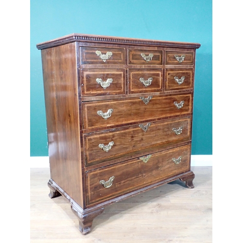 472 - An antique walnut and feather crossbanded Chest of six short and three graduated long drawers mounte... 