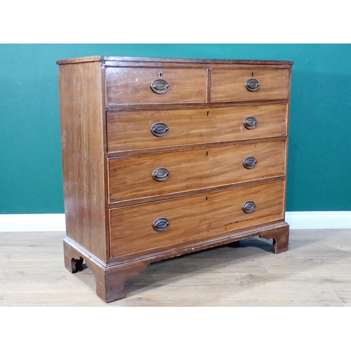 474 - A 19th Century mahogany Chest of two short and three long graduated drawers mounted on ogee bracket ... 